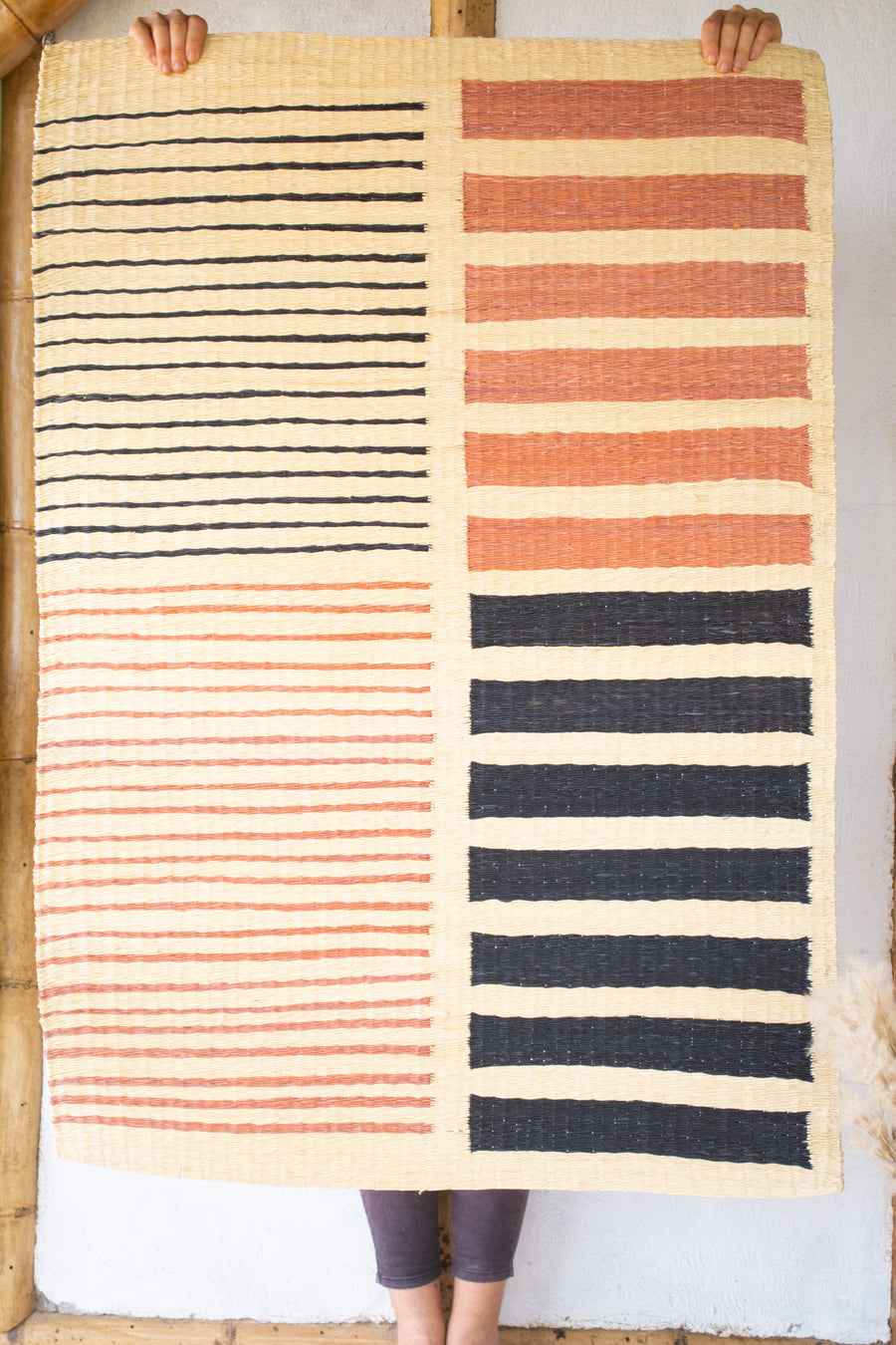 Contemporary palm weaving used as a rug or wall ahnging. Plant dyed and handwoven made in Colombia.