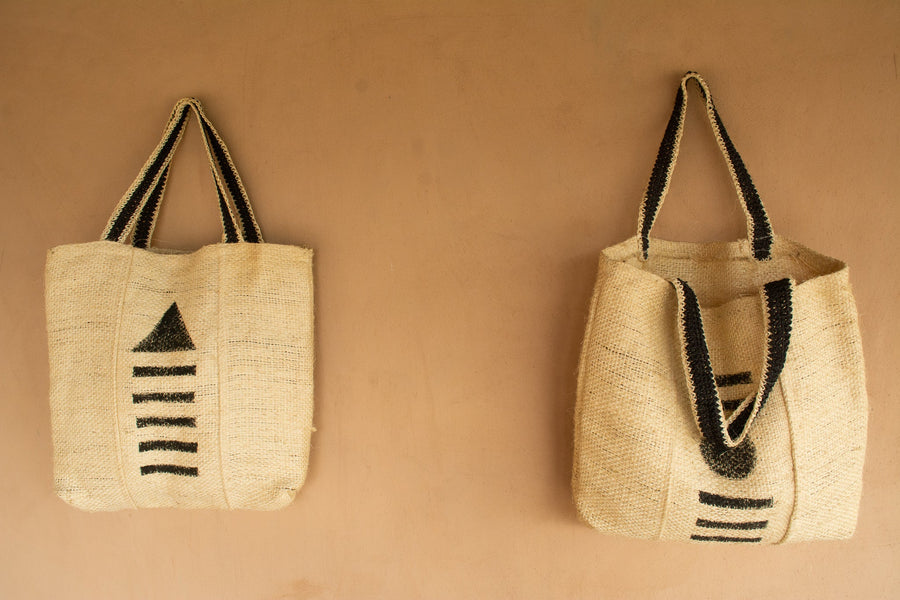 Large tote bags made from the natural fibre of the fique plant. Handblock printed design and hand crocheted straps.